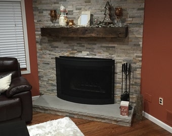 Distressed wood fireplace mantle
