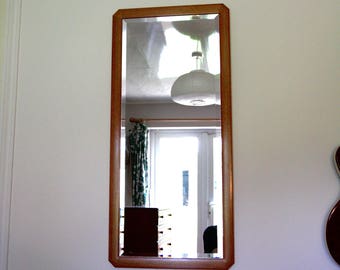 Bevelled Italian wall mirror with unusual wooden frame. Rare vintage item. Excellent condition.