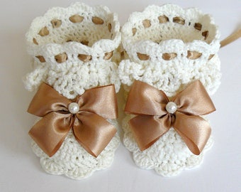White lace crochet baby booties for girls.