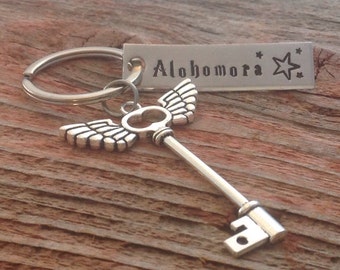 Alohomora hand stamped keychain inspired by Harry Potter inspired with a winged key charm