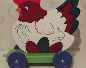 Toy shooting, hen with eggs, wooden
