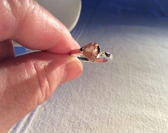 Oregon sunstone ring, beautiful trillion shaped pink Schiller with champagne highlight stone set in sterling silver!