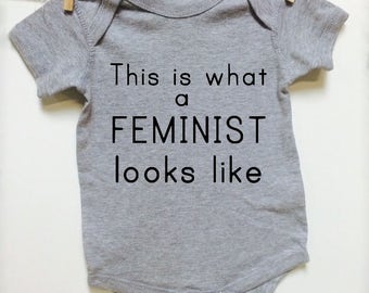 Baby Clothes. This is what a Feminist looks like. Gray short sleeve. baby announcement. Baby shower gift. Nasty Woman starter clothing :)