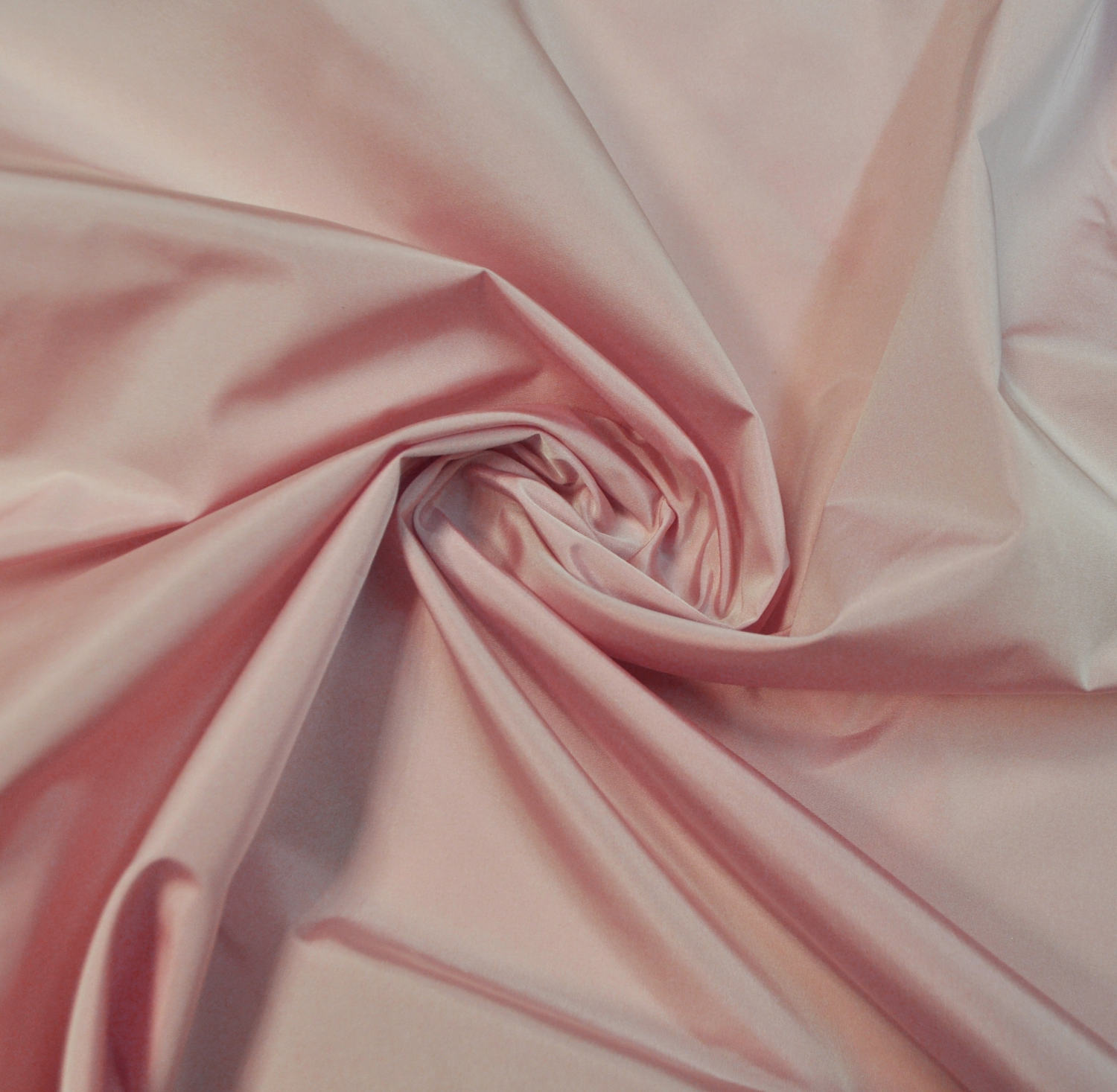 Iridescent taffeta fabric plain pink color 100% polyester.