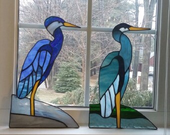 Stained glass bird.Glass ornament.Great blue heron.Glass window panel.Blue glass leaner.Blue suncatcher.Wading bird or standing on rock
