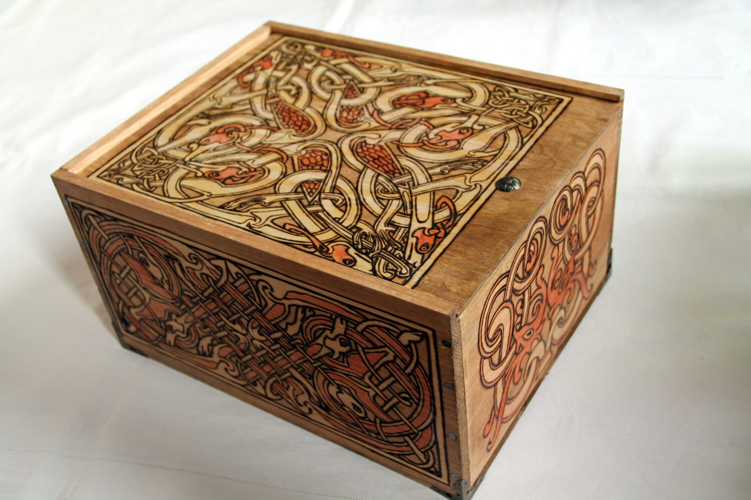 Wooden box carved with celtic patterns bird snake dog and