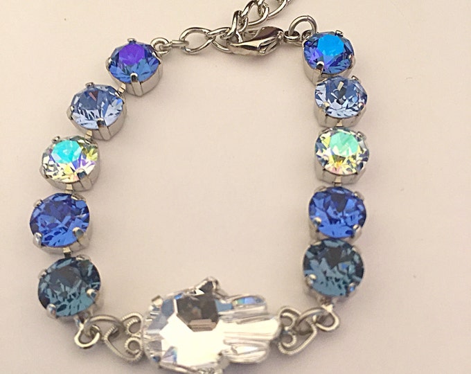 Bohemian Blue Hamsa protection bracelet in an ombre of blue Swarovski crystals. Sapphire blue crystals