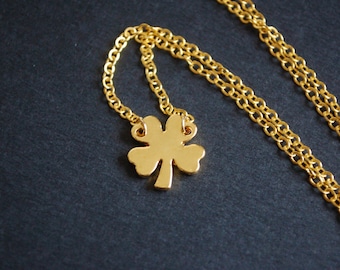 Gold tone four leaf clover necklace