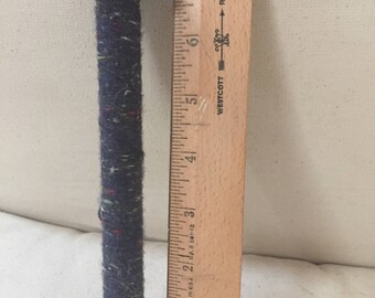Vintage wooden spool bobbin with thread