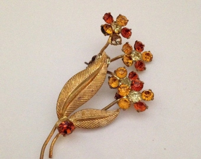 Storewide 25% Off SALE Vintage Gold Tone Amber Rhinestone Encrusted Daisy Flower Designer Brooch Featuring Etched Leaf Style Accents