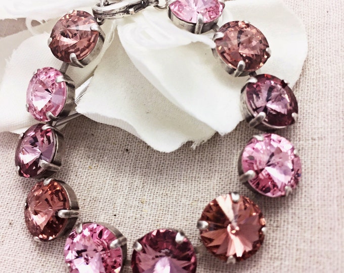 Pink Valentine's Statement bracelet adorned with 12mm rivoli Swarovski crystals in an ombre of pink that provide plenty of sparkle.