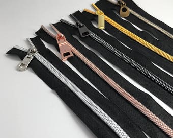 3 Yards of Black Zipper Tape. You think the teeth are metal but they are made of nylon.