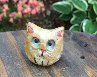 Cute little handmade kitty figurine with red nose