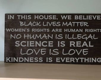 In this house, we believe/Black Lives Matter/Women's Rights are Human Rights/No Human is Illegal/Science is Real/Love is Love/Kindness