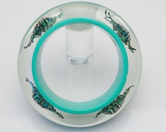 Blue lucite bangle with real iridescent beetles