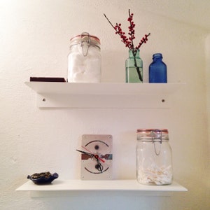 black floating shelves for bathroom