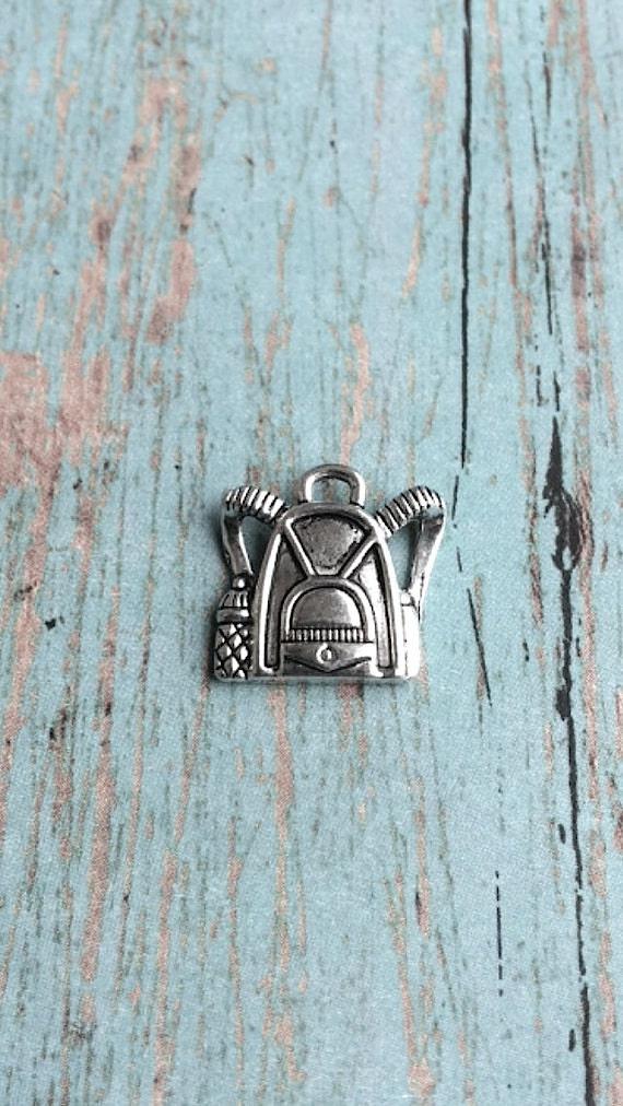 8 backpack charms 1 sided silver toned knapsack charms
