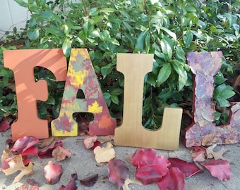 On Sale! FALL letters ready to hang. Real fall leaves preserved on the L. Burnt orange, Red, Yellow, Green, Gold. FALL decor
