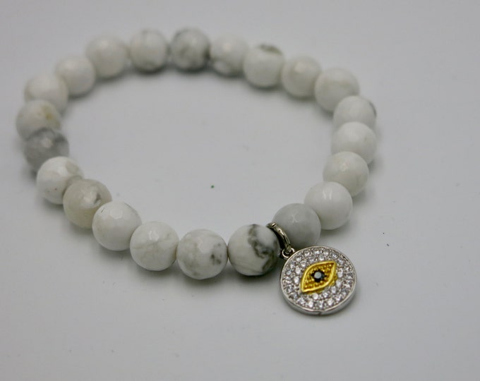 Natural white howlite crystal beaded Stretch Bracelet with a good luck, lucky, crystal evil eye charm.