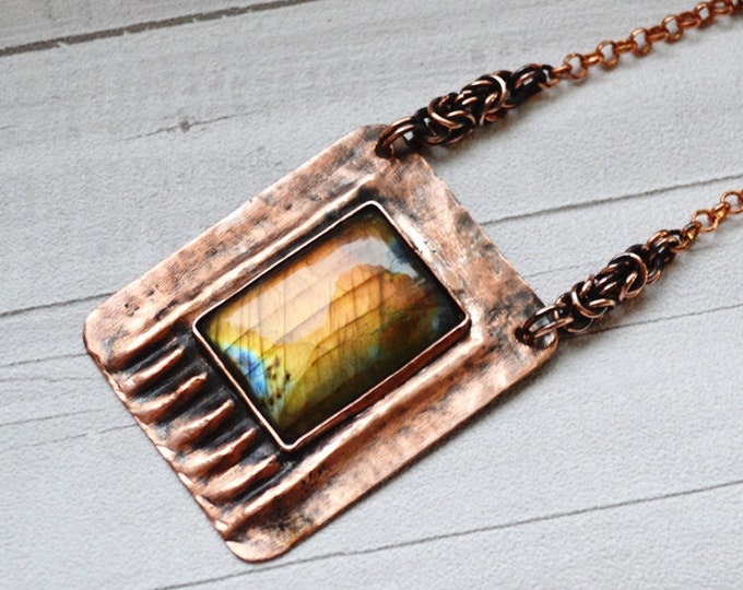 Stone labradorite in the copper metal plate necklace of the metal sheet necklace with the stone pendant labradorite fire labradorite copper