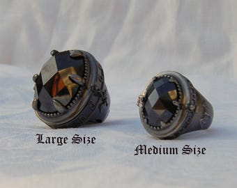 Poison ring with secret compartment. Stunning . Massive Gothic design with a fine cut Black Zirconia gem. Large and Heavy. Most impressive.