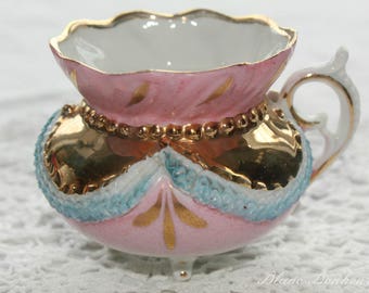German: Antique small pink & gold lovely footed demitasse