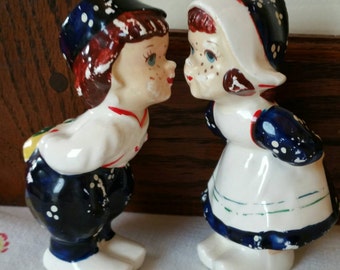 Vintage Dutch boy Romancing a Dutch girl leaning for a Kiss salt and pepper shakers made in Japan