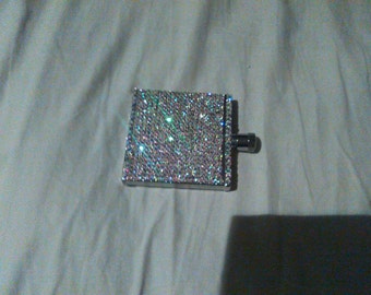 Crystal embellished hip flask. As seen on TV at the Grammy's with Rhianna. Holds 2oz of liquor. Stunning.