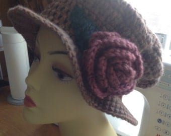 Ladies hand crochet rose trimmed hat. Bowler style knit hat.