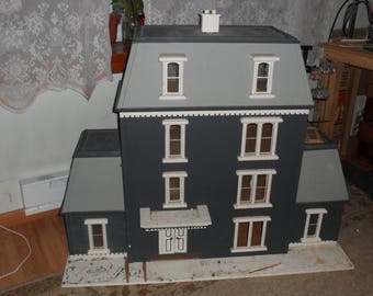 dollhouse measures 39 inches high by 4 feet long by 19 inches wide