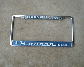 vintage license plate frame Hannan olds oldsmobile Louisville Ky.