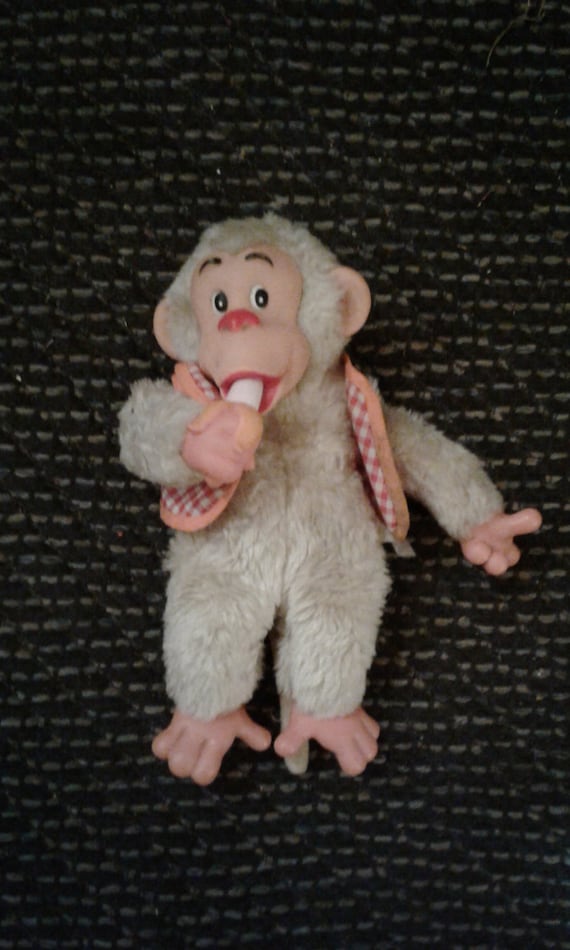 stuffed monkey with plastic face