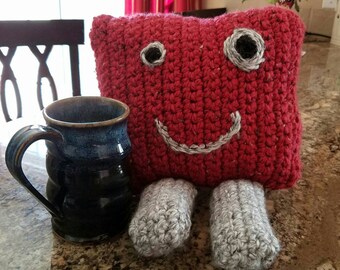 Handmade crocheted monster plush stuffed pillow.