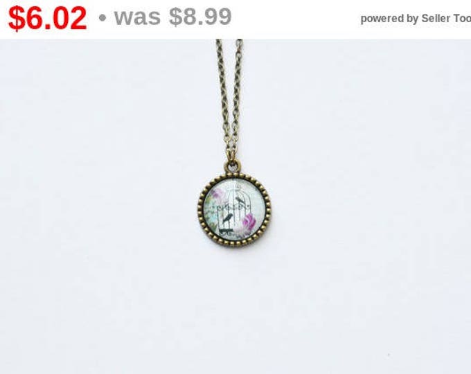 Shabby chic Round pendant with the image of glass and brass with a chain retro and vintage antique bronze color