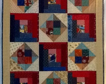 Quilt of log cabin squares and diamonds giving it a rustic feeling. Great for that little guy's crib, car seat or just to cuddle with.