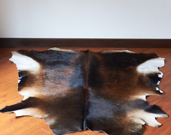 Cow hide rug | Etsy