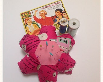 Pink pincushion made from vintage style sewing fabric