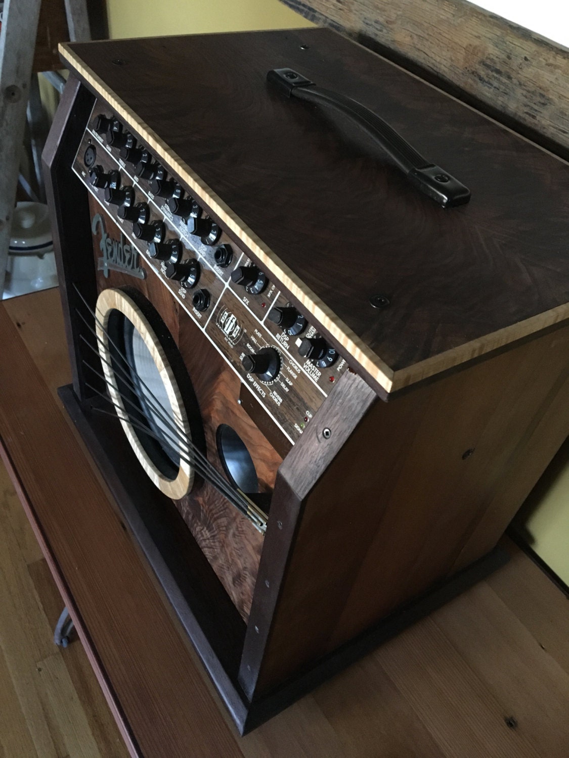 Acoustic Fender guitar amplifier in a handmade wooden case