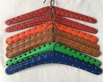 60 's vintage clothing pendants/charms for the coat rack. Imitation leather with studs.