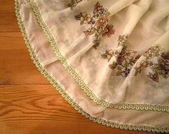 white scarf with green crochet beaded trim