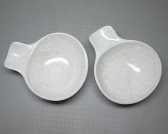Glidden pottery 2 bowls number 467 , white glaze with speckles .