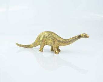 brass dinosaur figurine