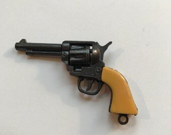 Minature Cast Cap Gun with Yellow Plastic Grips