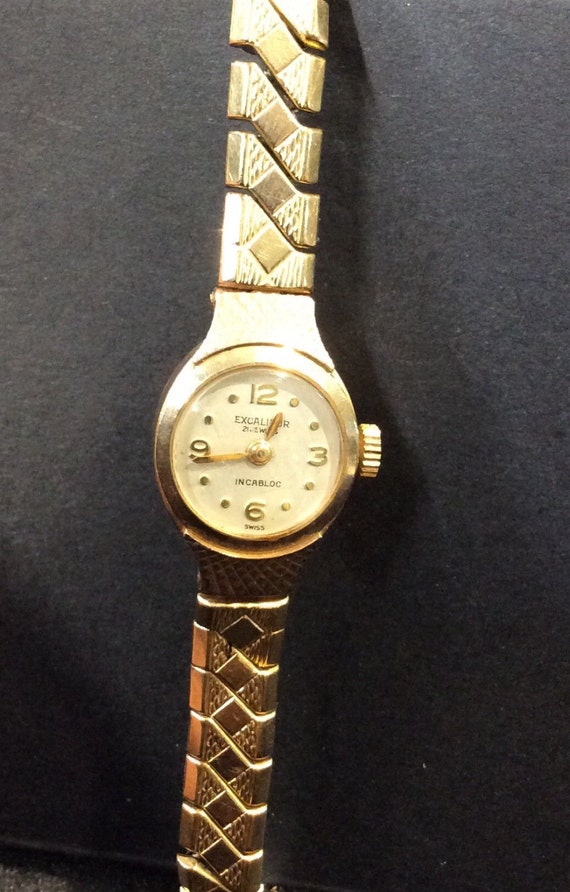 Gold Excalibur ladies watch on expanding bracelet