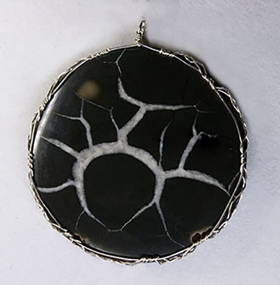 Septarian stone wrapped in a Celtic style with sterling silver