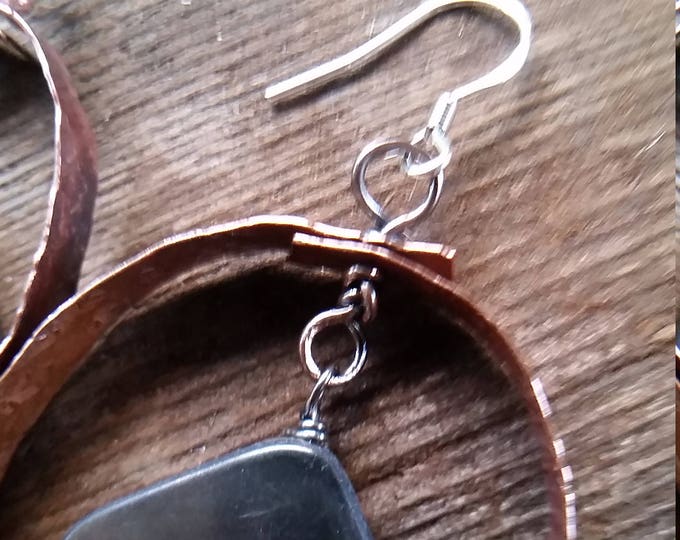Copper Hoops, Hammered, Texture, and Heated for Patina. The drop is a Dark Mother of Pearl with lots of Colors Reflected in Them.