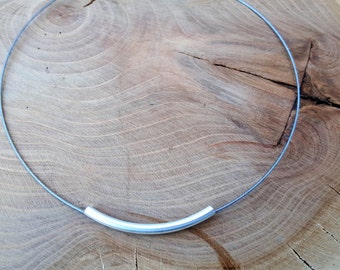 Necklace with metal tube