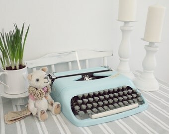 Consul light blue small working condition portable typewriter with case
