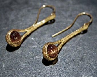 Yellow gold earrings with rutilated quartz