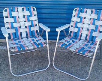 Vintage pair of retro aluminum webbed lawn chairs blue white pink yellow